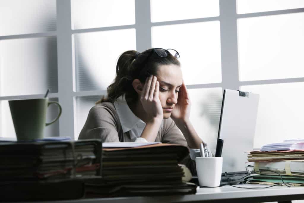 chronic stress in a woman at a desk